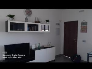 Televízia a/alebo spoločenská miestnosť v ubytovaní Merlo's Gaviotas. (Apartamento). + 10 fotografií