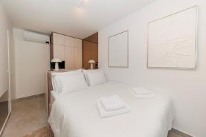 Ένα ή περισσότερα κρεβάτια σε δωμάτιο στο Stars Premium Apartment by Belmont Realty