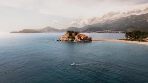 a small island in the middle of a body of water at Villa Milan in Sveti Stefan