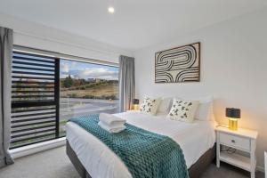 Giường trong phòng chung tại Magic on Rowley