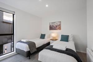 Giường trong phòng chung tại Magic on Rowley +5 ảnh