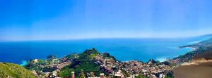 a view of a town on a mountain next to the ocean at Casa Damico in Castelmola
