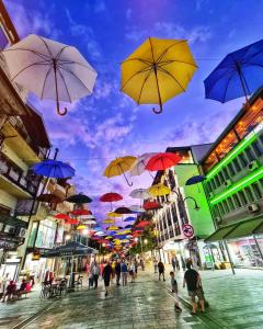 a group of umbrellas hanging over a city street at PARIS Luxury Center Apartment STRUGA in Struga