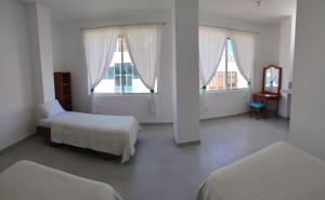 Postel nebo postele na pokoji v ubytování Gallardos Suite