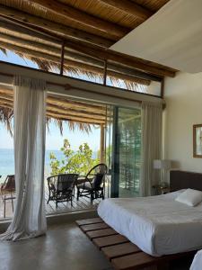 Postel nebo postele na pokoji v ubytování Pirámide Títi