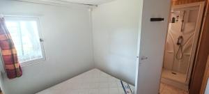 Ένα ή περισσότερα κρεβάτια σε δωμάτιο στο Appartement au sémaphore