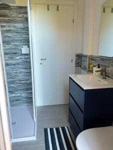 a bathroom with a sink and a shower at Casa Giulé in Imperia +20 photos