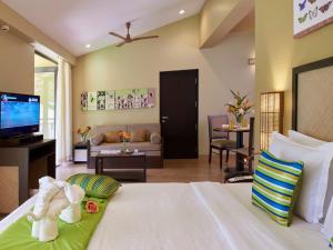 Postel nebo postele na pokoji v ubytování Club Mahindra Virajpet, Coorg