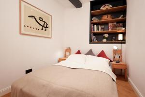a bedroom with a bed and a book shelf at Studio 1833 in Michelstadt