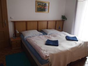 Postel nebo postele na pokoji v ubytování Apartmány Tisá 452