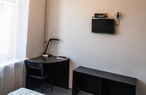 TV a/nebo společenská místnost v ubytování Vilnius Centre Flat