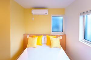 Postel nebo postele na pokoji v ubytování Luce Stay&Resort Evoluto101