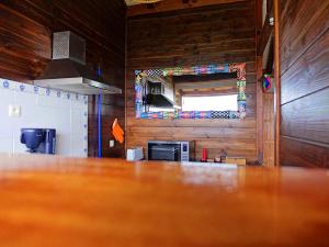 a kitchen with a wooden floor and a counter top at karureve in Deshaies