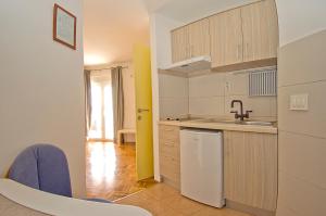 a kitchen with a sink and a counter top at Apartments Tomato 1 in Novigrad Istria +16 photos