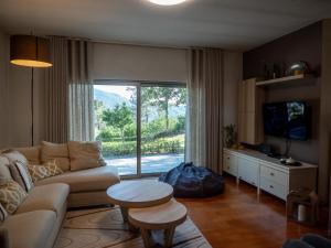a living room with a couch and a table at Tapada do Sobral in Vilar de Ferreiros
