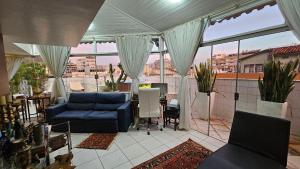 Χώρος καθιστικού στο Piscina com Vista - Quarto em Cobertura Duplex
