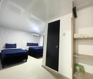 Postel nebo postele na pokoji v ubytování Bless Hotel