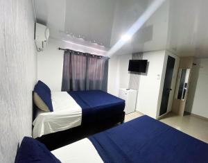 Postel nebo postele na pokoji v ubytování Bless Hotel
