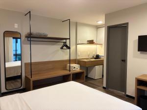 Ένα ή περισσότερα κρεβάτια σε δωμάτιο στο Flat no Edifício Interative Jardins by InnSide - 5 min da Av Paulista