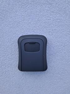 a black object on the side of a wall at House Virginia in Santa Cruz