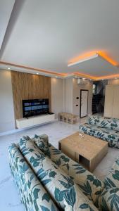 a living room with two couches and a coffee table at Villa Lea - 4 km to the sea 9 km to the airport in Antalya