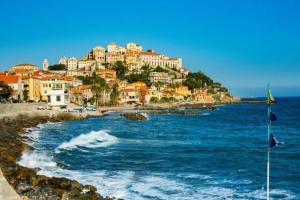 a view of a town on the shore of the ocean at Lyhnida Vacation Home in Imperia