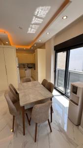 a dining room with a table and chairs at Villa Lea - 4 km to the sea 9 km to the airport in Antalya