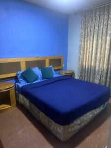 Postel nebo postele na pokoji v ubytování Conord Hotel