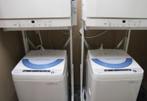 twointendo wii game systems sitting next to each other at Condominium Hotel Monpa in Chatan