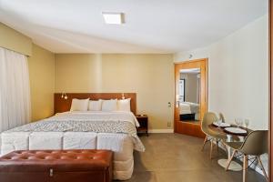Postel nebo postele na pokoji v ubytování Suite INSIDE Interative Jardins