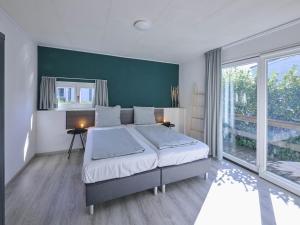 Postel nebo postele na pokoji v ubytování t Kaatsheuveltje 6