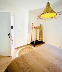 a bedroom with a bed in a room at Casa Fidalgo in Santo António da Terrugem