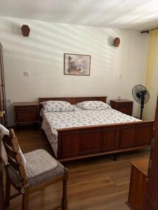 a bedroom with two beds and a fan at Apartments by the sea Cove Donja Kruscica - Donja Krusica, Solta - 15636 in Grohote +17 photos