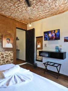 TV a/nebo společenská místnost v ubytování Habitaciones Colonial Zaci
