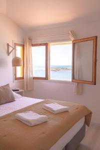 Katil atau katil-katil dalam bilik di Apartamentos Alborada