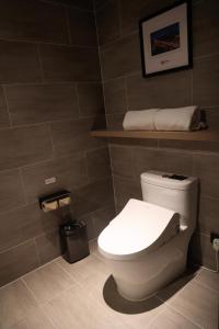 a bathroom with a white toilet in a room at Atour Hotel Shanghai Xianxia in Shanghai