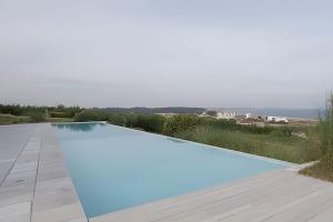 a swimming pool with a view of the ocean at Sierra Ballena 2 in Punta del Este