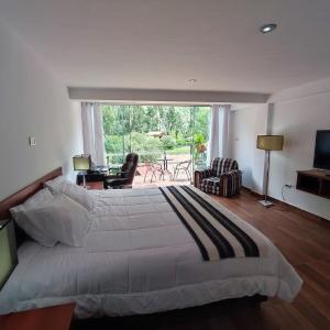 Et tv og/eller underholdning på Balcones del Río Calca Casa de campo