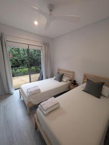 Postel nebo postele na pokoji v ubytování 2 bedroom apartment with Garden views in Sydney