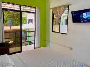 Ένα ή περισσότερα κρεβάτια σε δωμάτιο στο Hostería "El Paraíso" +39 φωτογραφίες