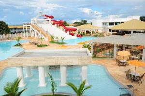 a resort with a slide and a water park at L'acqua Diroma - o Melhor de Caldas - Com Piscinas de Ondas in Caldas Novas