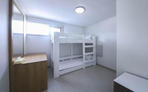 Postel nebo postele na pokoji v ubytování Joy Hotel
