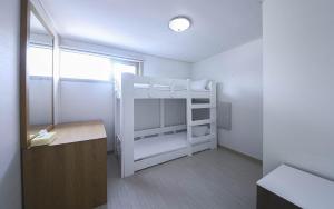 Postel nebo postele na pokoji v ubytování Joy Hotel