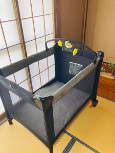 a black bunk bed sitting in a room at 燕三条 For Days Japanese-style old house for rent in Sanjo