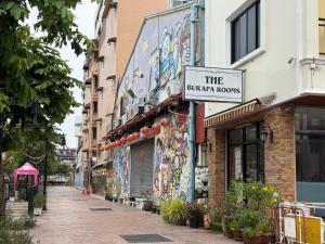 a building with a sign that reads the bazar rooms at The Burapa Rooms in Bangkok +23 photos