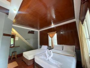 Voodi või voodid majutusasutuse Big Fish Resort Koh Tao toas