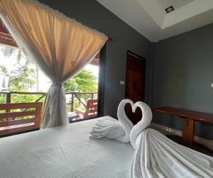 Voodi või voodid majutusasutuse Big Fish Resort Koh Tao toas