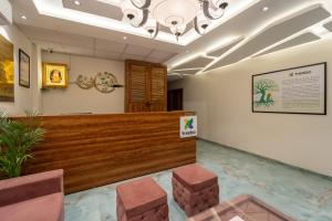 a lobby of a hospital with a waiting room at Hotel Vedic Vista in Indore