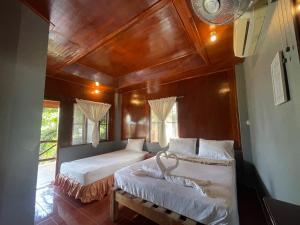 Voodi või voodid majutusasutuse Big Fish Resort Koh Tao toas