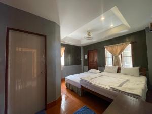 Voodi või voodid majutusasutuse Big Fish Resort Koh Tao toas